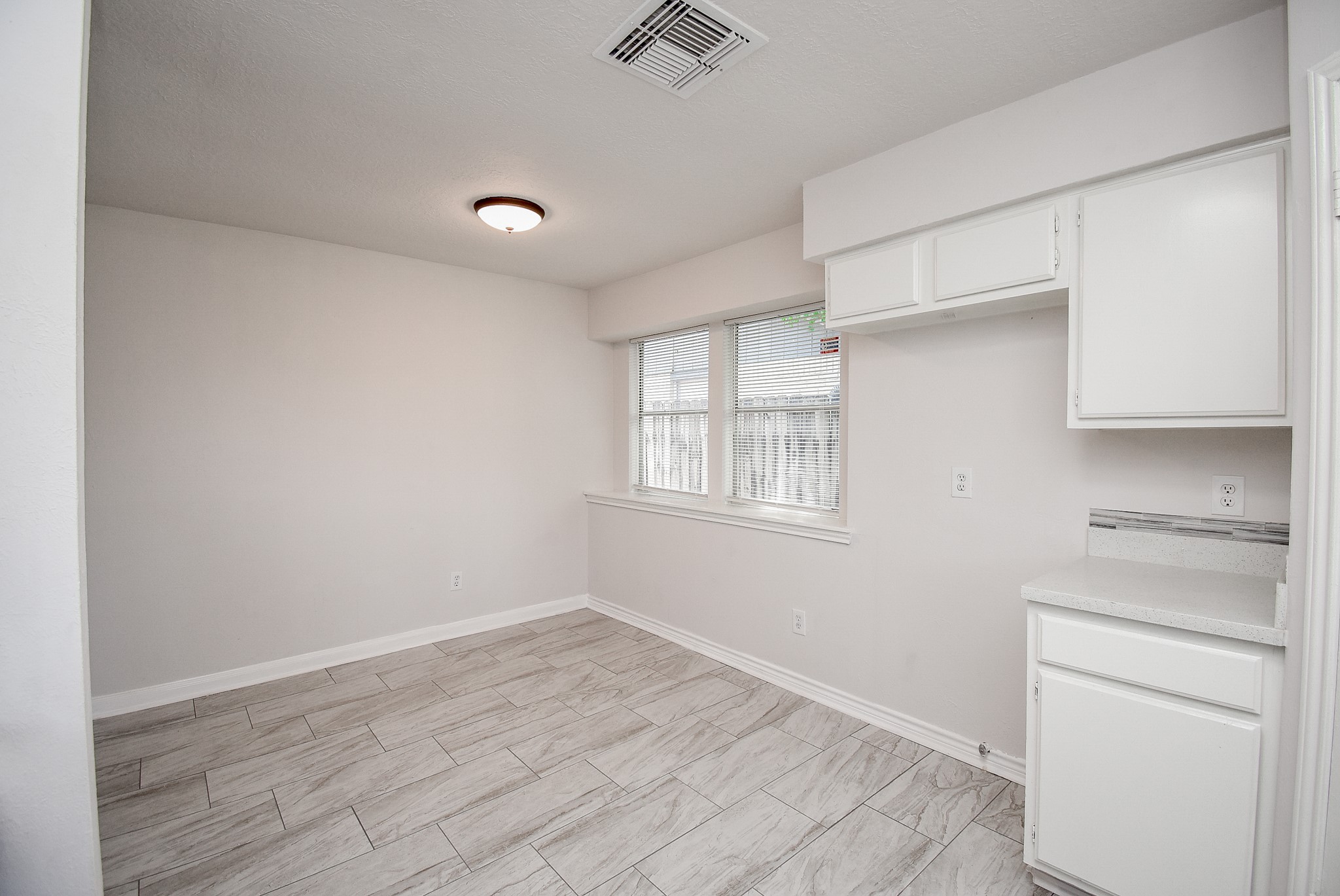 9527 Kingsvalley Drive Houston, TX 77075 - Photo 16 of 45 wooden floor in an empty room with a window