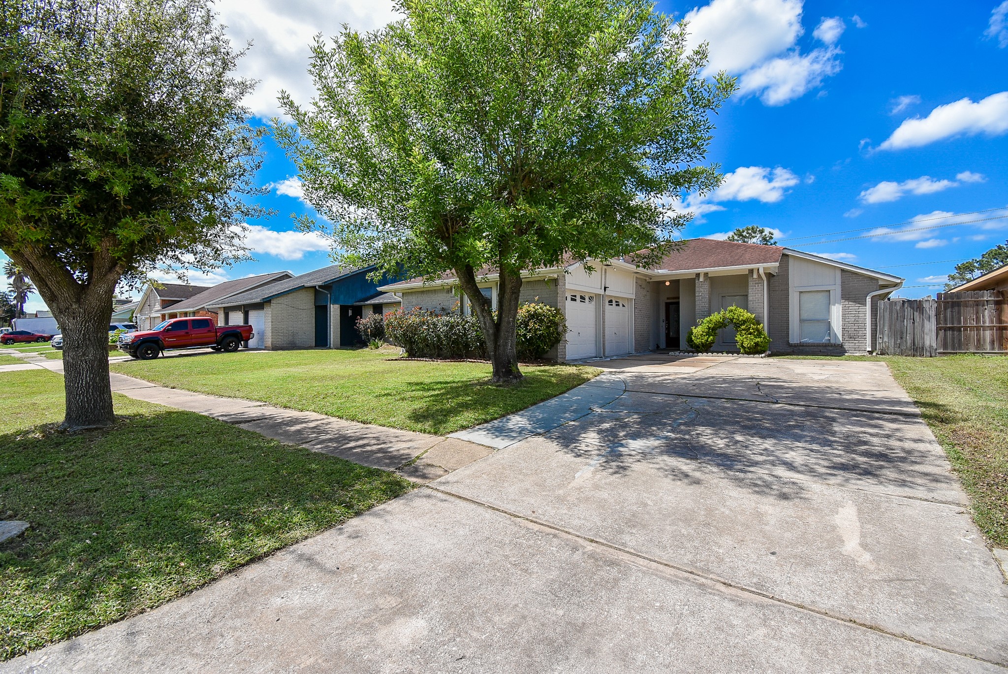 9527 Kingsvalley Drive Houston, TX 77075 - Photo 2 of 45 a front view of a house with a yard
