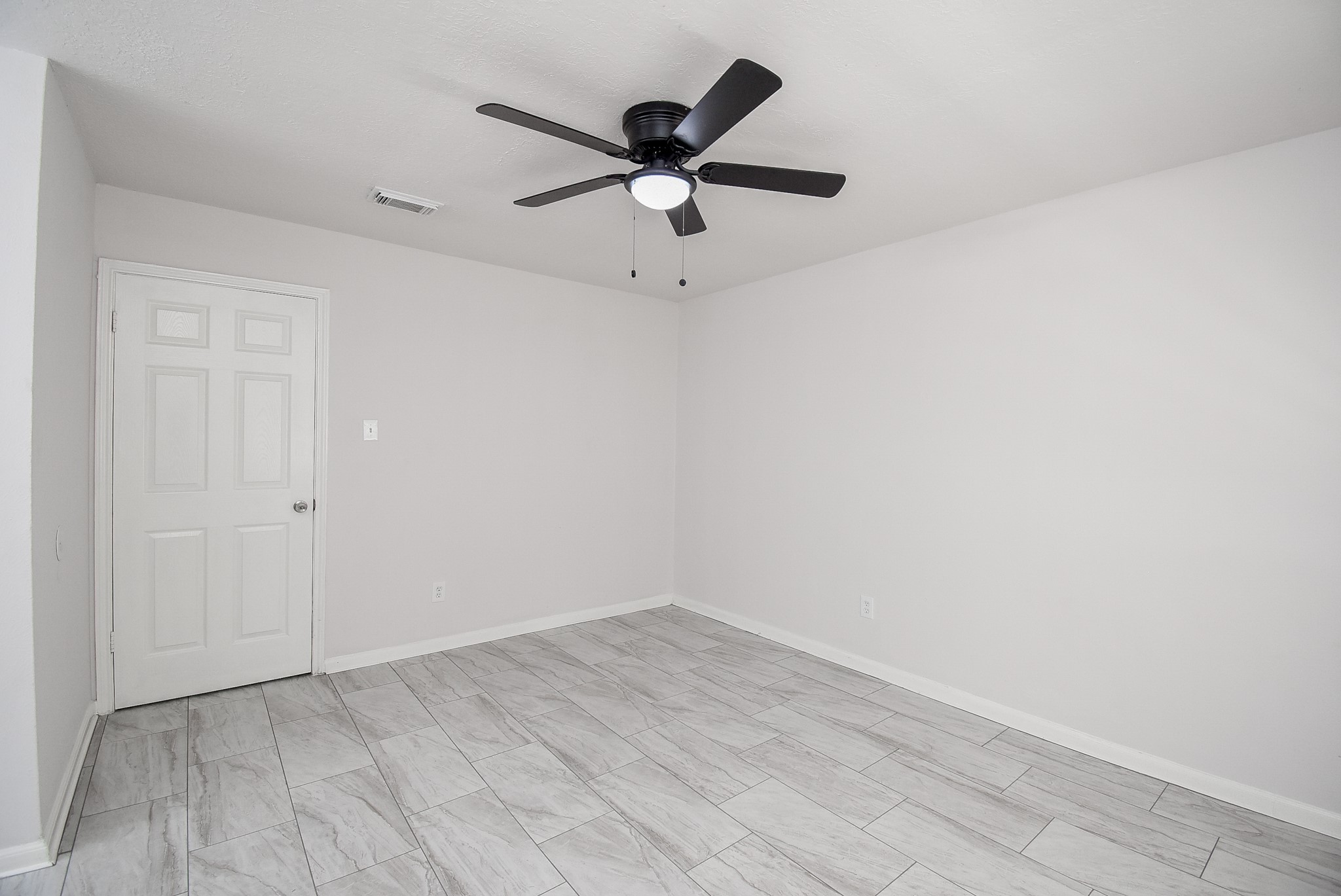 9527 Kingsvalley Drive Houston, TX 77075 - Photo 24 of 45 a view of empty room with wooden floor