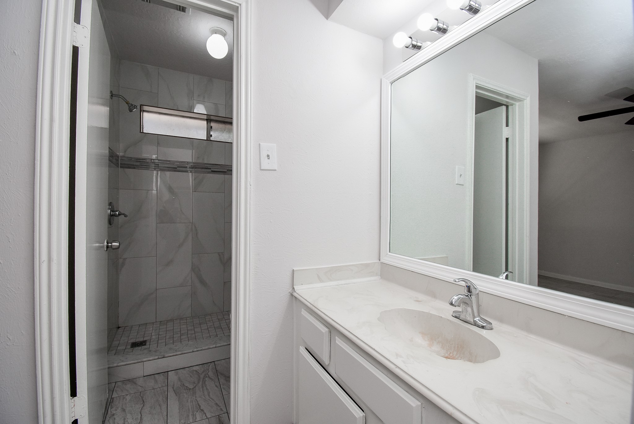 9527 Kingsvalley Drive Houston, TX 77075 - Photo 26 of 45 a bathroom with a sink and a mirror