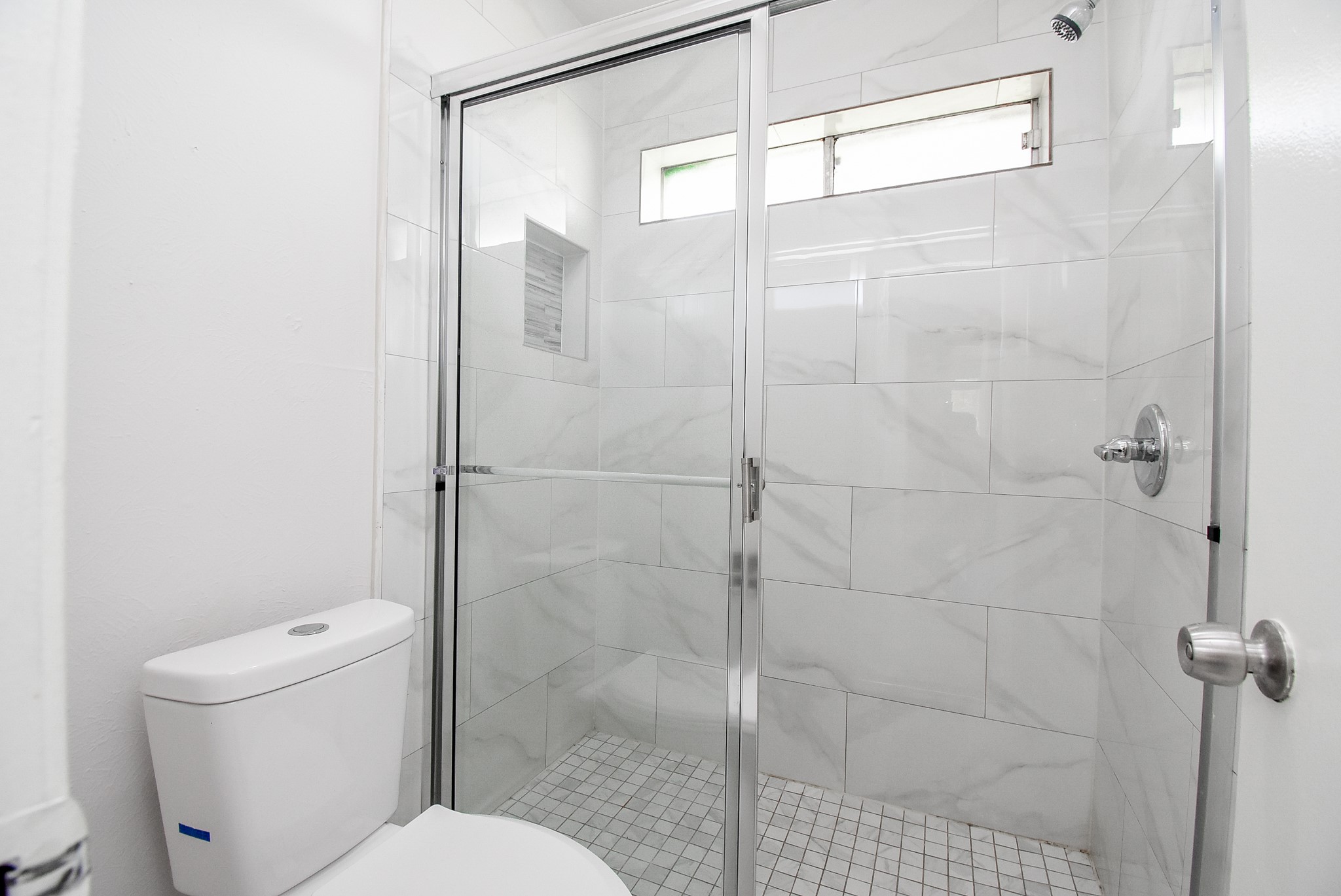 9527 Kingsvalley Drive Houston, TX 77075 - Photo 36 of 45 a bathroom with a shower and toilet