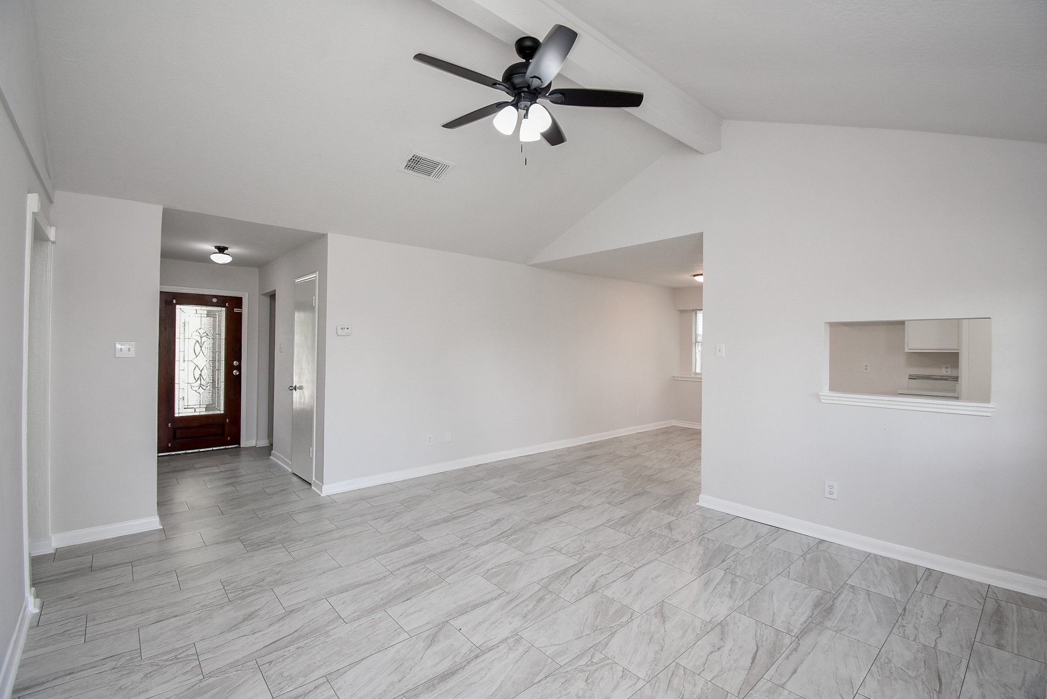 9527 Kingsvalley Drive Houston, TX 77075 - Photo 10 of 45 wooden floor in an empty room with a fan