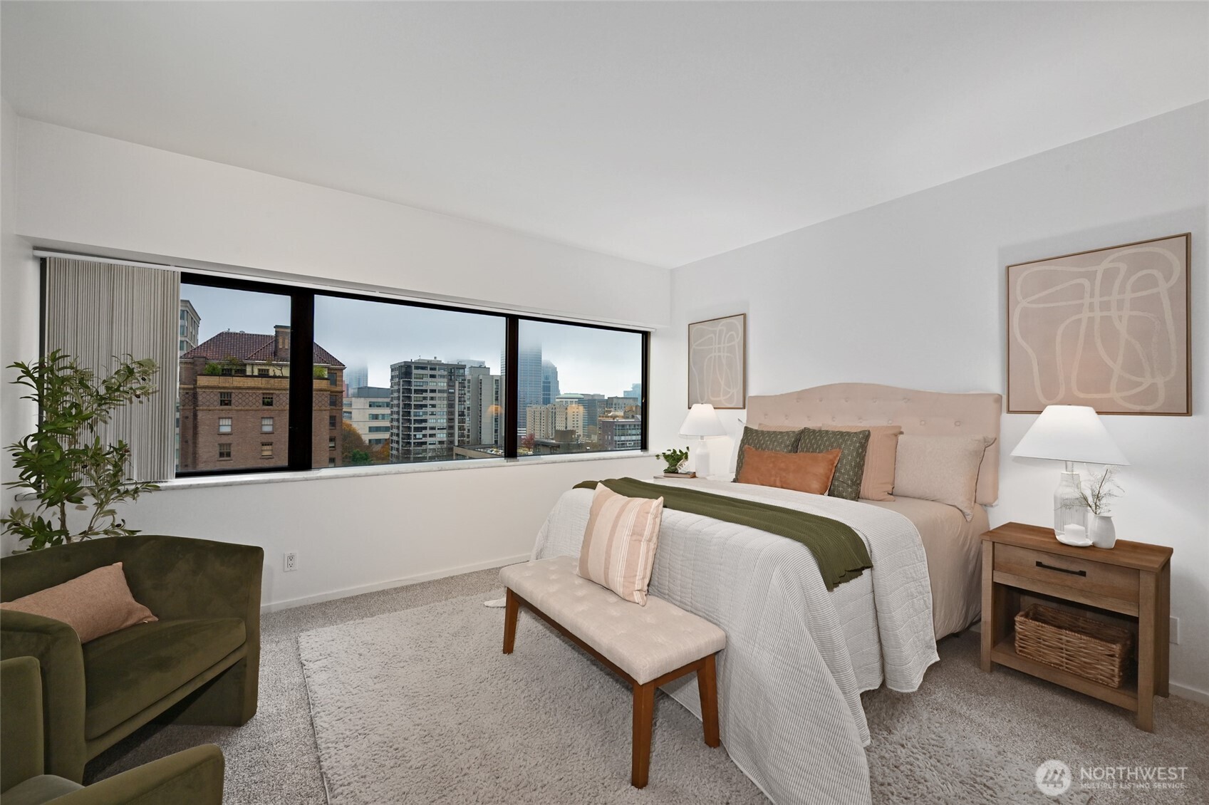 1301 Spring Street, Unit 10F Seattle, WA 98104 - Photo 13 of 36 a living room with furniture and a large window