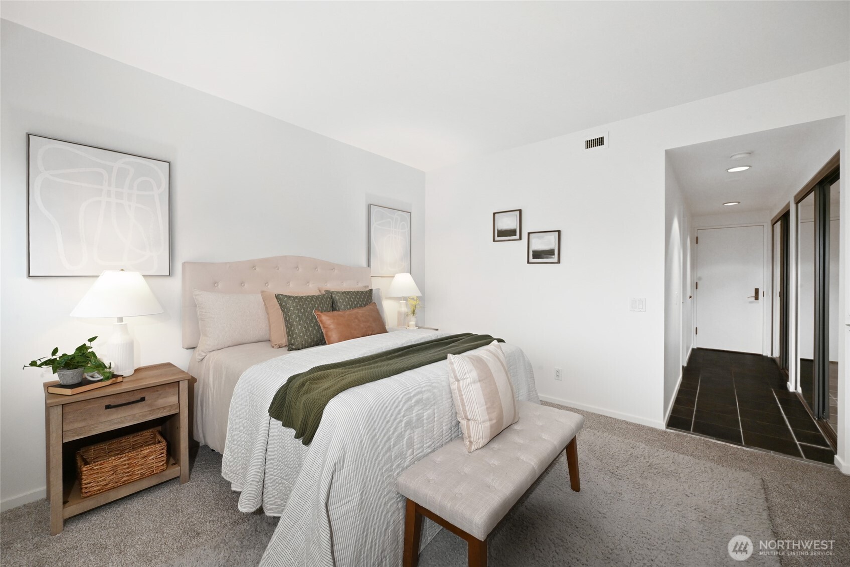 1301 Spring Street, Unit 10F Seattle, WA 98104 - Photo 15 of 36 a bedroom with a bed and a couch