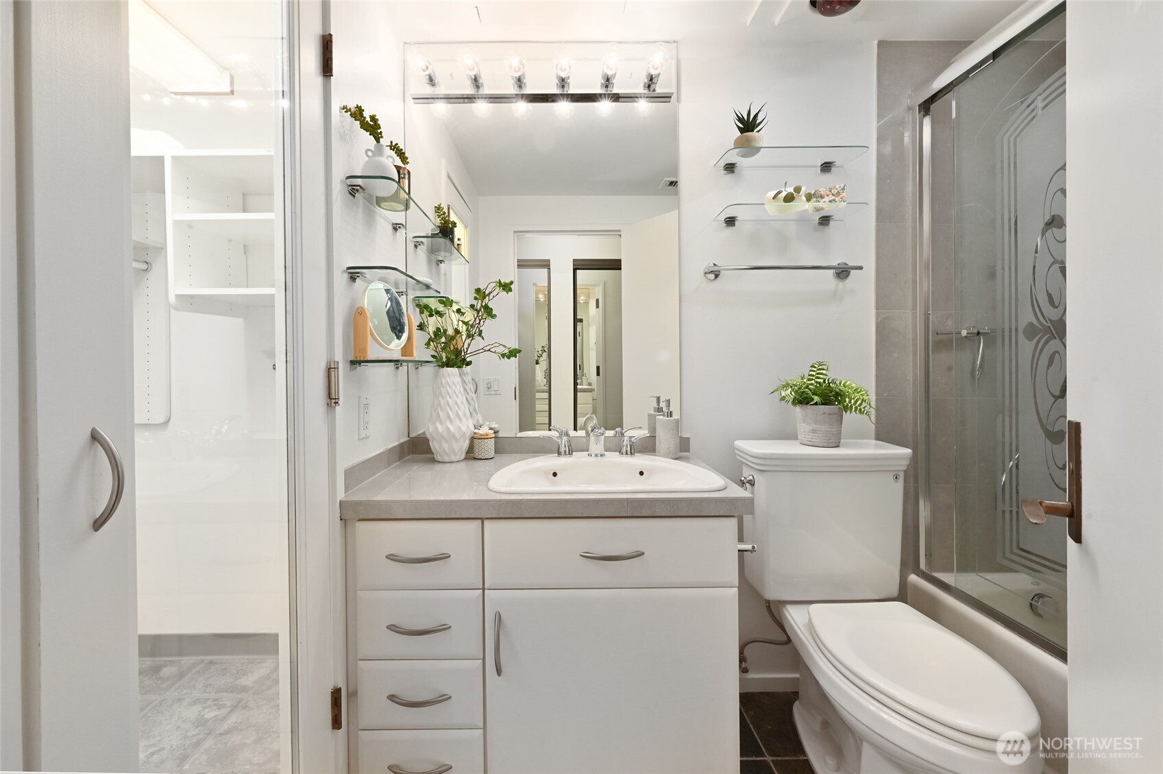 1301 Spring Street, Unit 10F Seattle, WA 98104 - Photo 17 of 36 a bathroom with a sink a toilet and shower