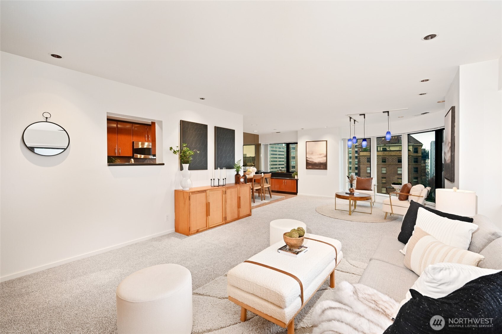1301 Spring Street, Unit 10F Seattle, WA 98104 - Photo 4 of 36 a living room with furniture and a large window