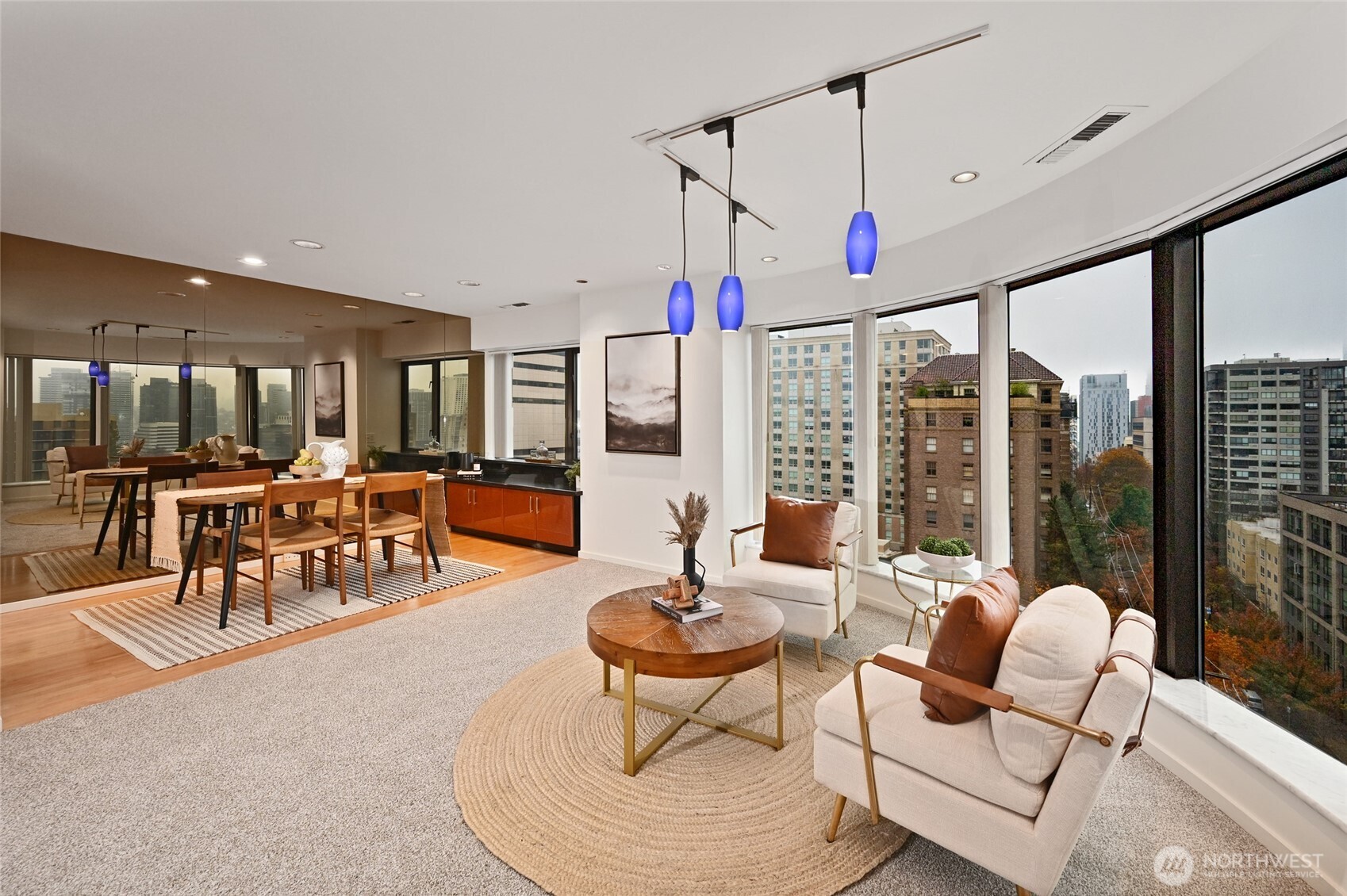 1301 Spring Street, Unit 10F Seattle, WA 98104 - Photo 5 of 36 a living room with furniture and a large window