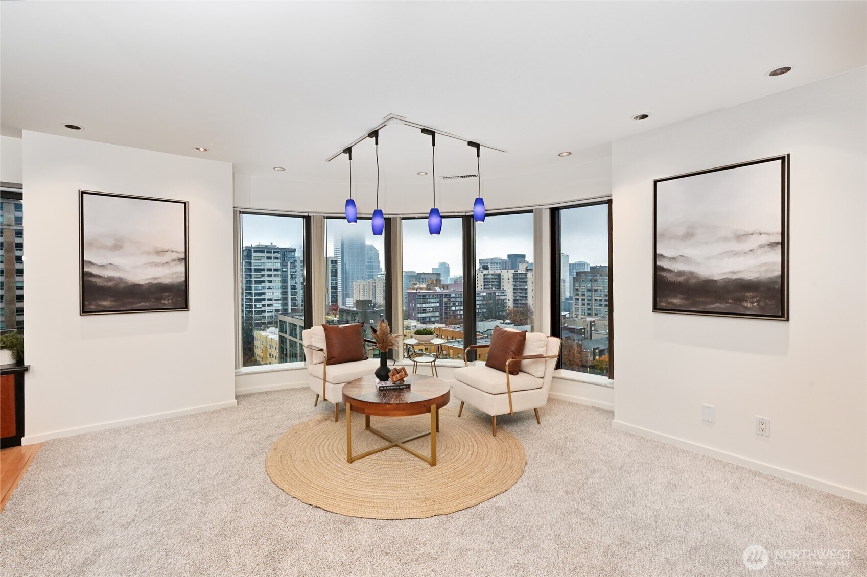 1301 Spring Street, Unit 10F Seattle, WA 98104 - Photo 6 of 36 a living room with furniture and a large window