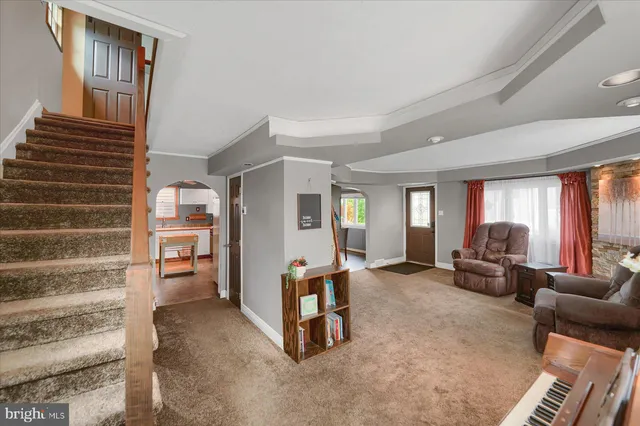 a view of a livingroom with furniture and windows