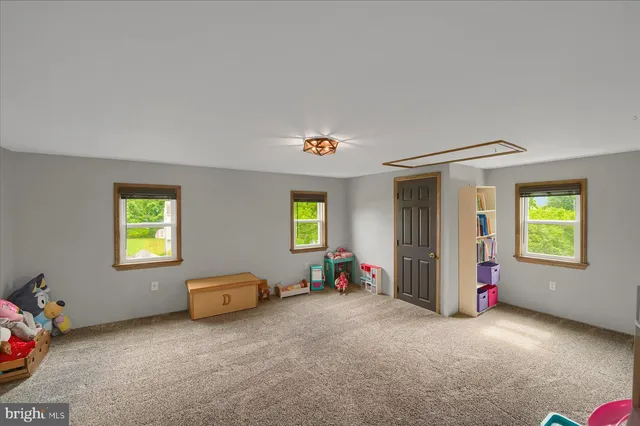 a view of livingroom with furniture and window