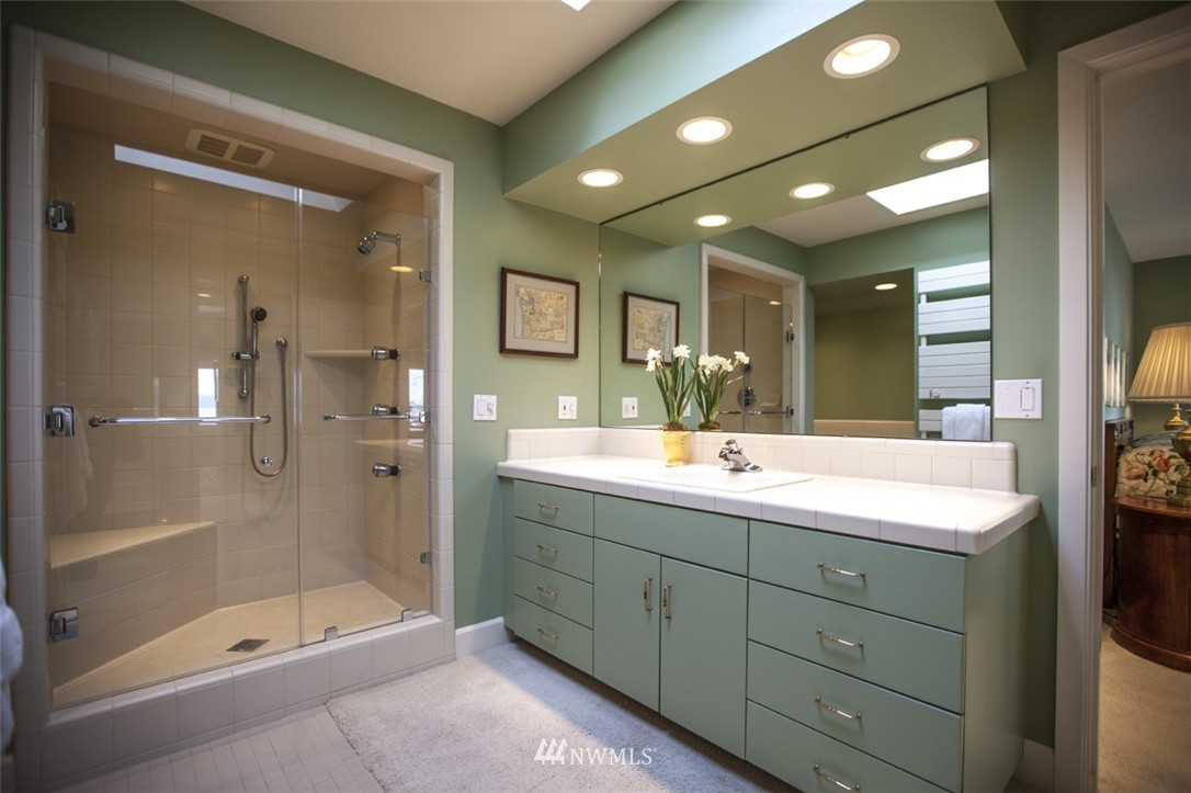 346 Bayside Road Bellingham, WA 98225 - Photo 15 of 25 a bathroom with a shower sink double and mirror