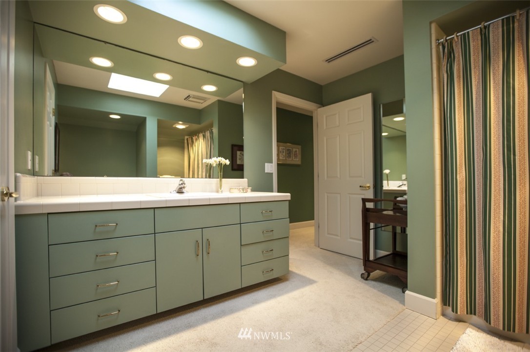 346 Bayside Road Bellingham, WA 98225 - Photo 18 of 25 a bathroom with a double vanity sink and a mirror