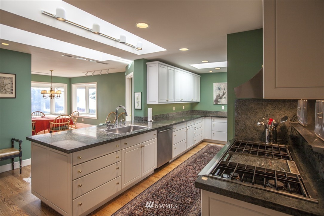 346 Bayside Road Bellingham, WA 98225 - Photo 5 of 25 a kitchen with stainless steel appliances granite countertop a stove and a sink
