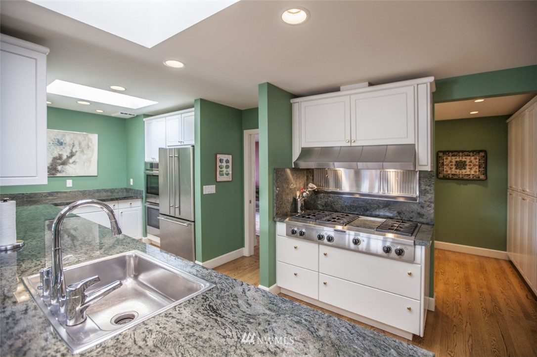 346 Bayside Road Bellingham, WA 98225 - Photo 6 of 25 a kitchen with stainless steel appliances granite countertop a sink stove and refrigerator