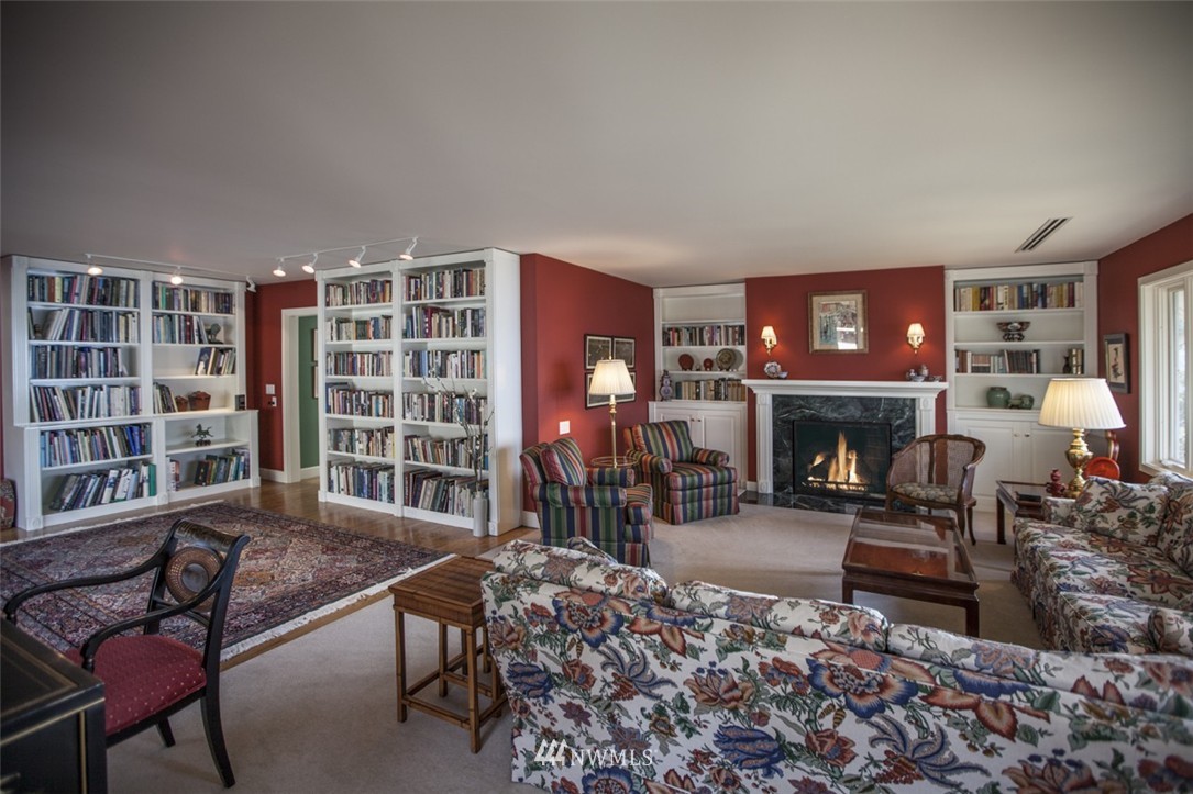 346 Bayside Road Bellingham, WA 98225 - Photo 7 of 25 a living room with furniture a fireplace and a large window