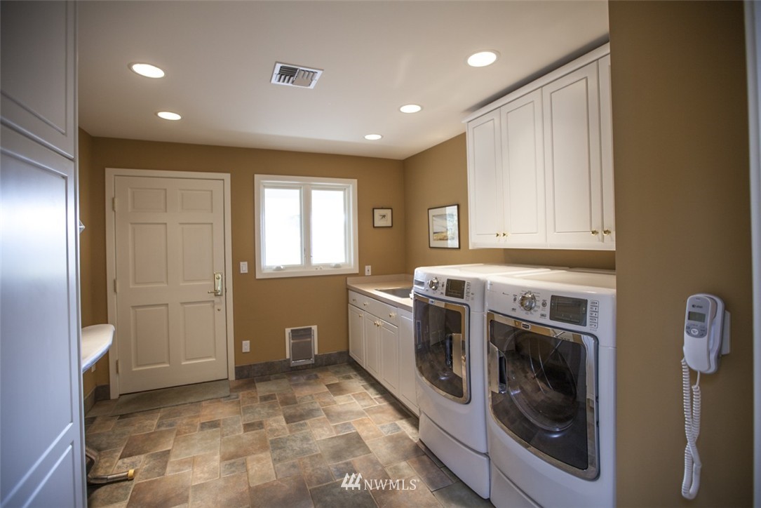 346 Bayside Road Bellingham, WA 98225 - Photo 10 of 25 a kitchen with a stove top oven and cabinets
