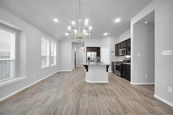 a view of a kitchen and dining room