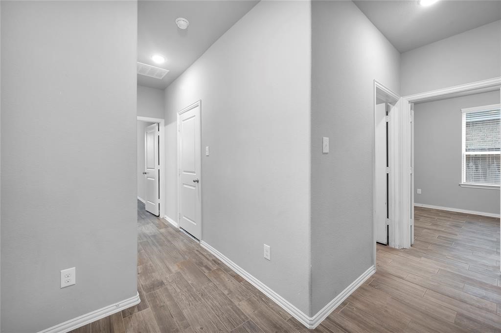 3137 Dunsmore Manor Court Spring, TX 77386 - Photo 32 of 32 wooden floor in a hall with an entryway