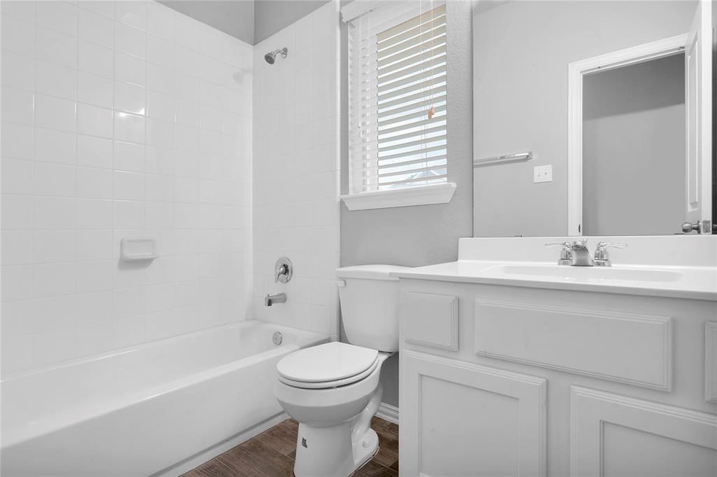 3137 Dunsmore Manor Court Spring, TX 77386 - Photo 19 of 32 a bathroom with a sink a toilet and shower