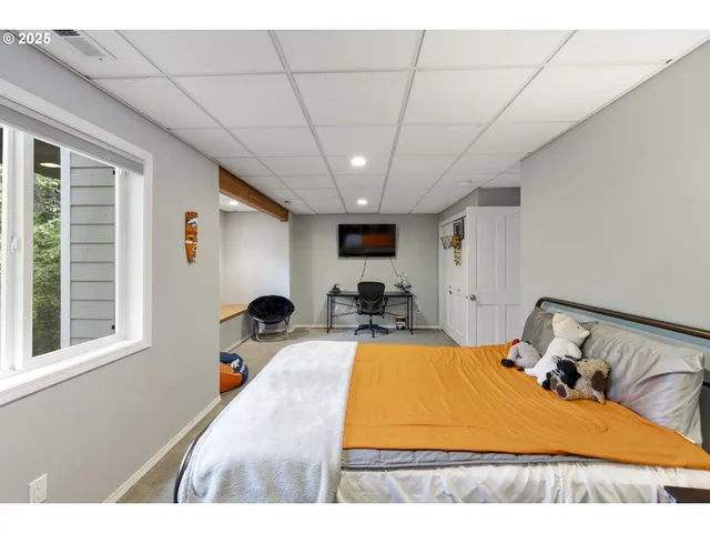 a bathroom with a sink a toilet a mirror and shower