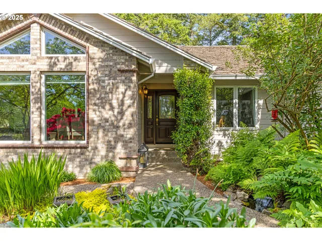 a view of dining room and livingroom with furniture wooden floor a chandelier