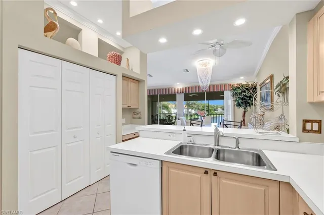 a kitchen with a sink and a refrigerator