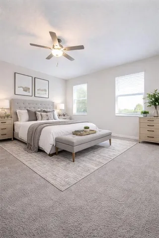 a bedroom with a bed and window