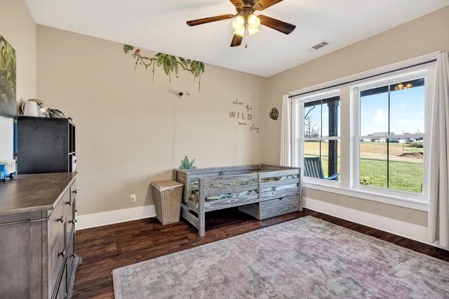 a view of a garage with rack and bicycle