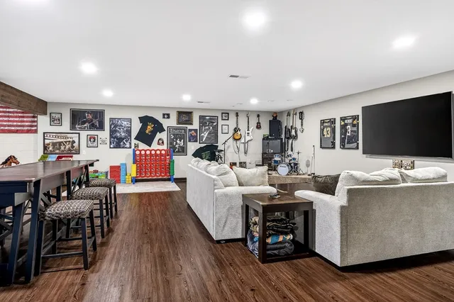 a view of a yard with plants and trees