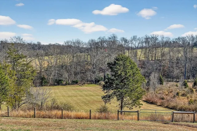 a front view of house with yard outdoor seating and patio