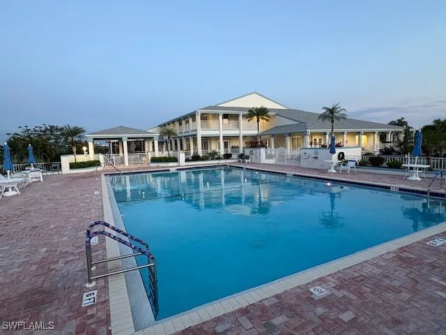 a front view of a house with swimming pool