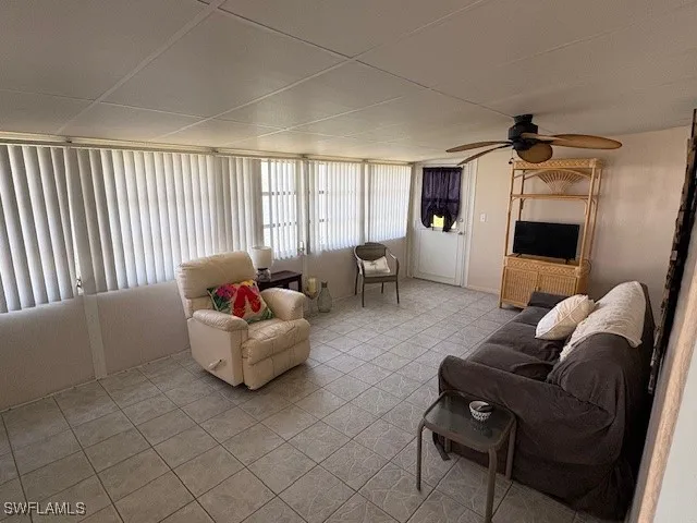 a living room with furniture and a window