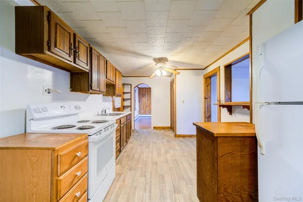 a view of a kitchen with a sink and dishwasher