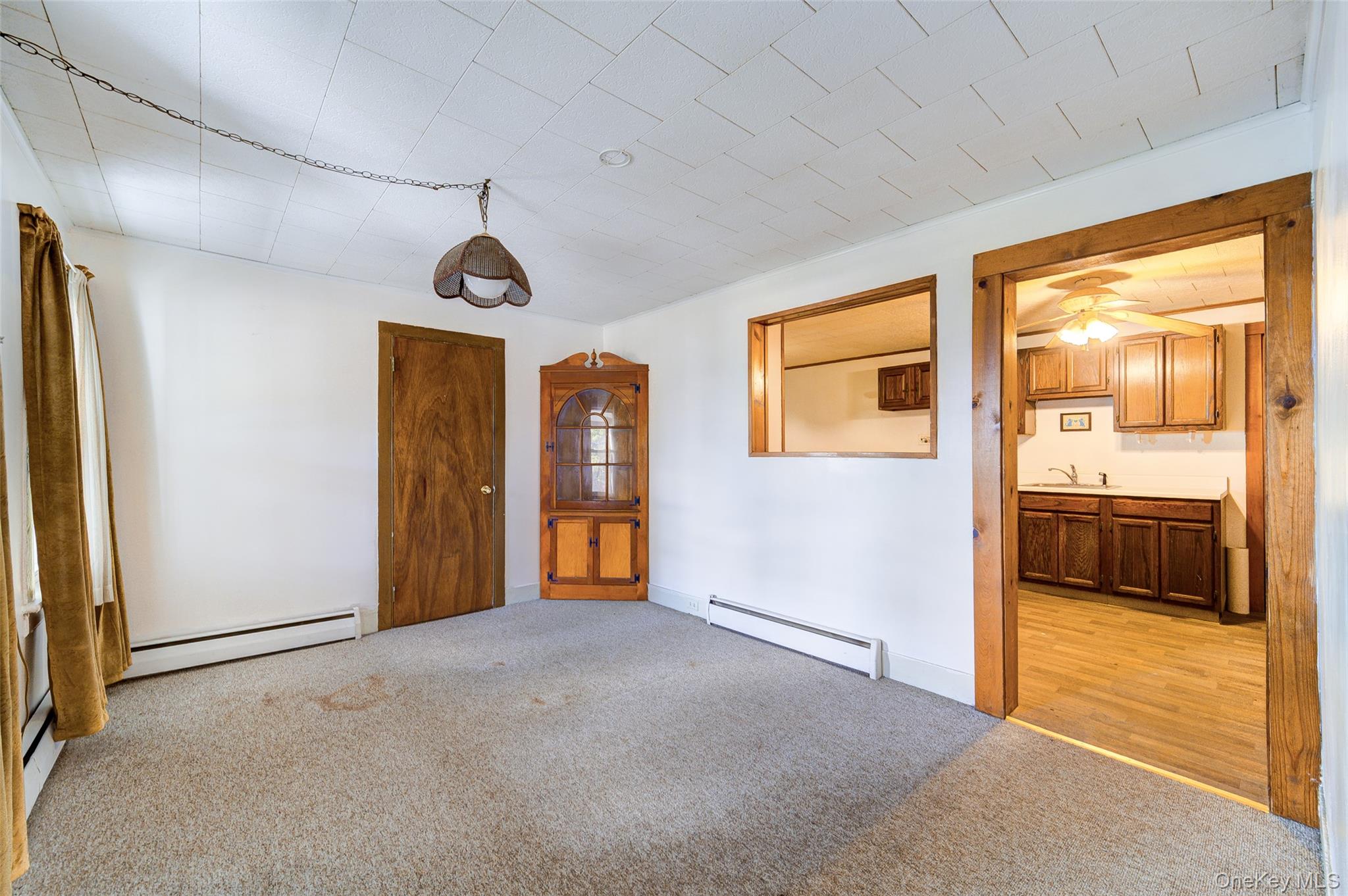 166 Brookside Farms Road Newburgh, NY 12550 - Photo 13 of 45 a view of a livingroom with wooden floor and a ceiling fan