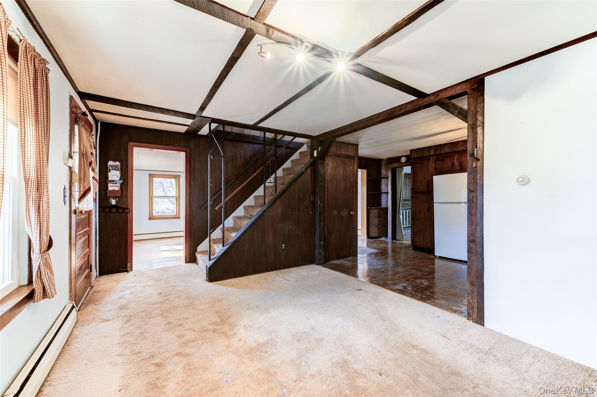 166 Brookside Farms Road Newburgh, NY 12550 - Photo 17 of 45 a view of a hallway with wooden floor and staircase