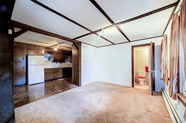 a kitchen with stainless steel appliances a stove a refrigerator and a sink
