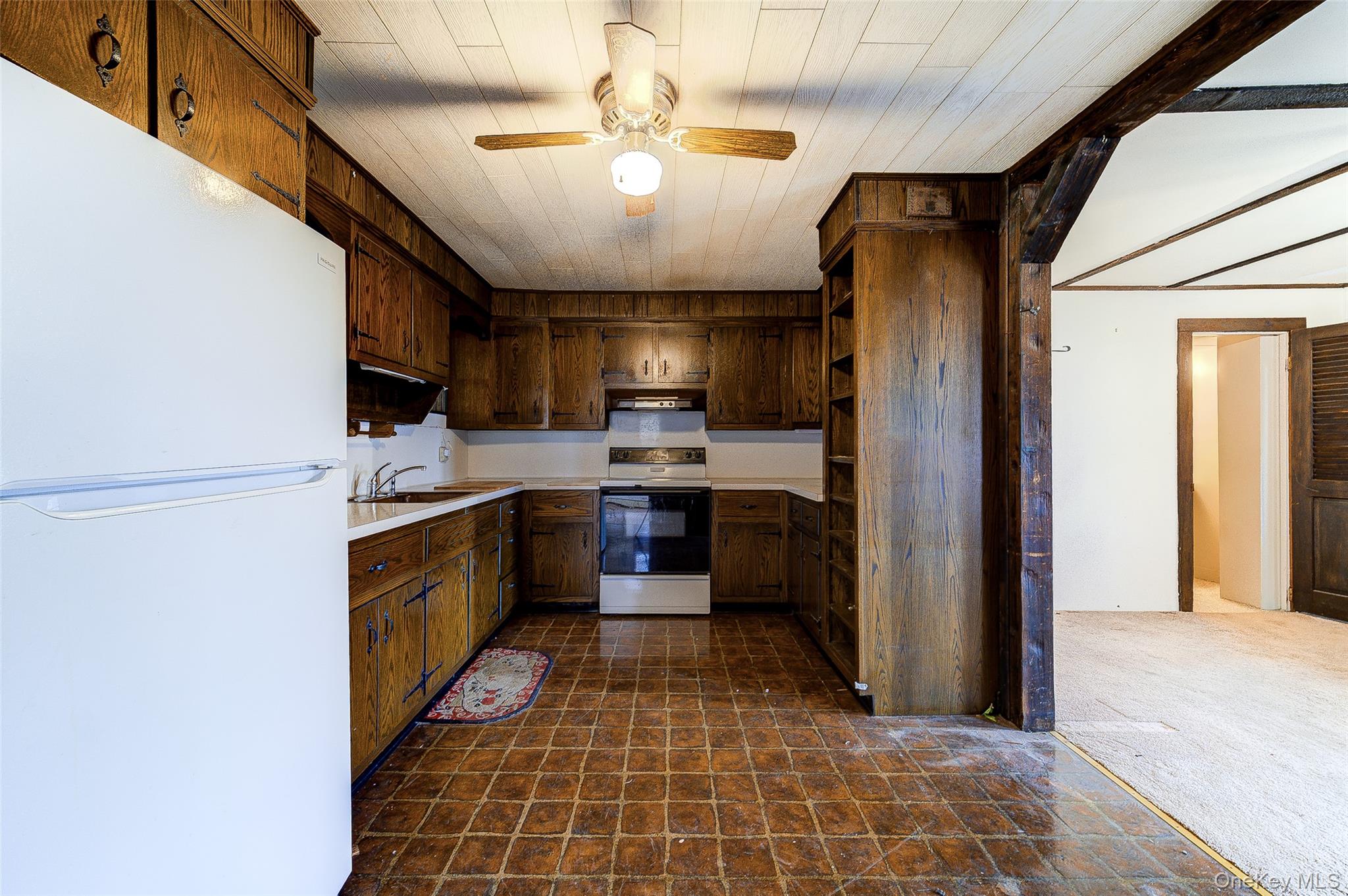 166 Brookside Farms Road Newburgh, NY 12550 - Photo 20 of 45 a kitchen with a refrigerator a sink and a stove