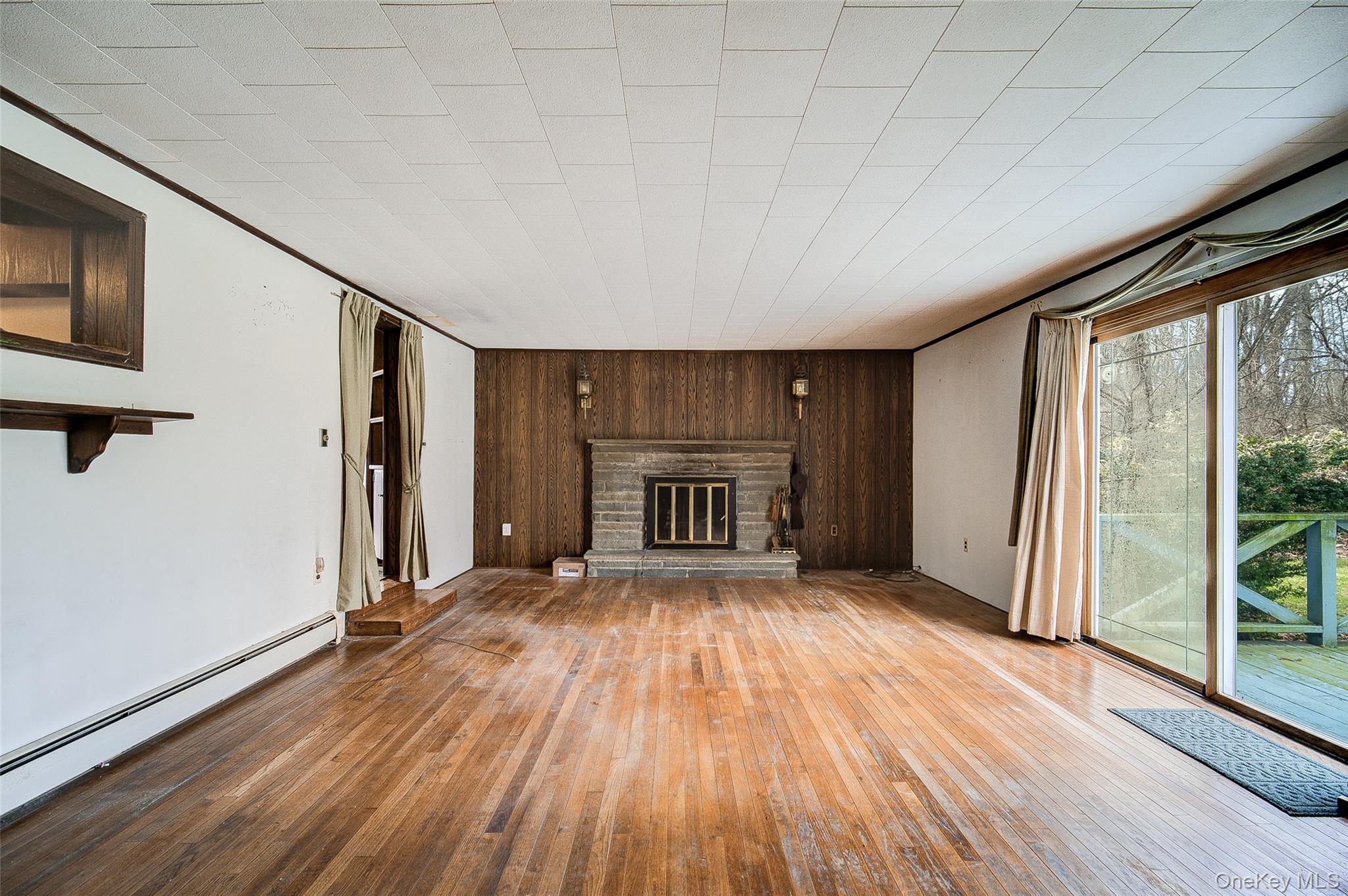166 Brookside Farms Road Newburgh, NY 12550 - Photo 23 of 45 a view of empty room with wooden floor and fan