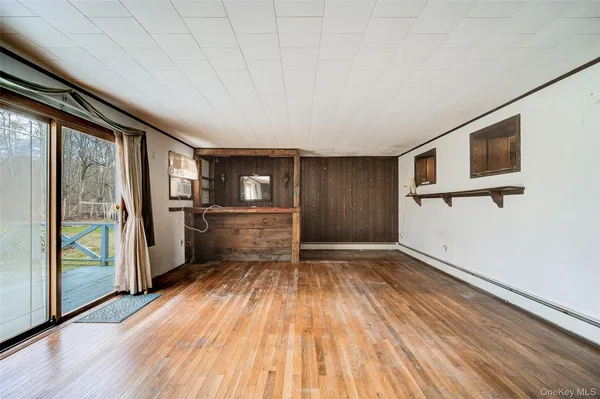a view of livingroom with hardwood floor and hallway