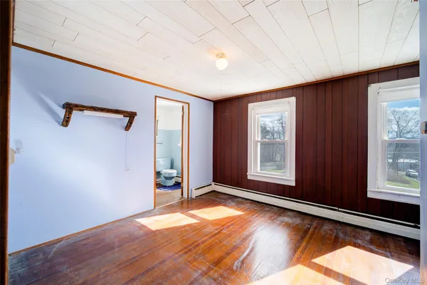 a view of an empty room and a window