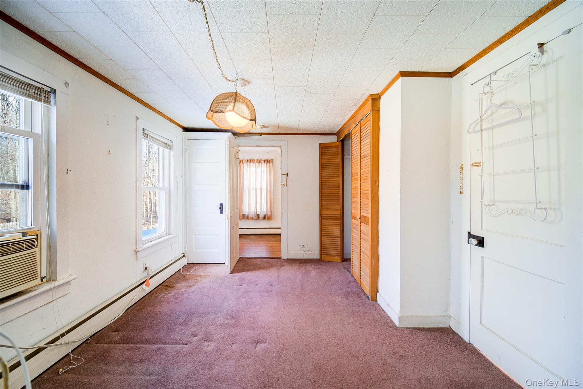 166 Brookside Farms Road Newburgh, NY 12550 - Photo 34 of 45 a view of a hallway with bathroom and front door