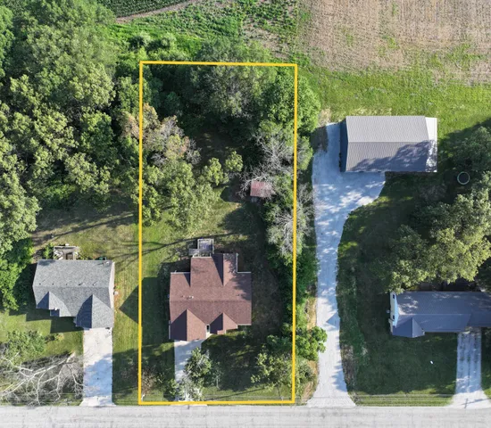 an aerial view of houses with yard