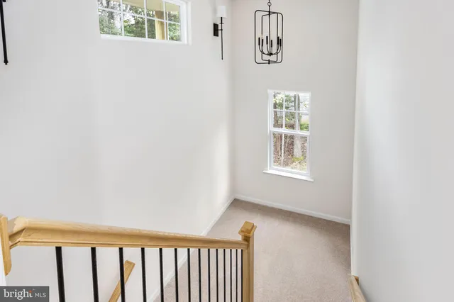 a view of a livingroom with a ceiling fan and window