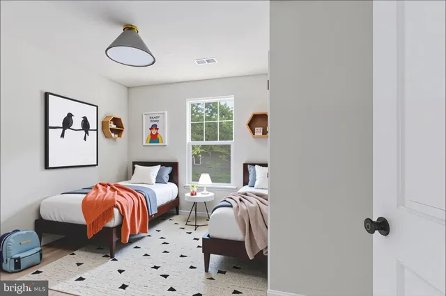 a kitchen with stainless steel appliances kitchen island sink refrigerator and microwave