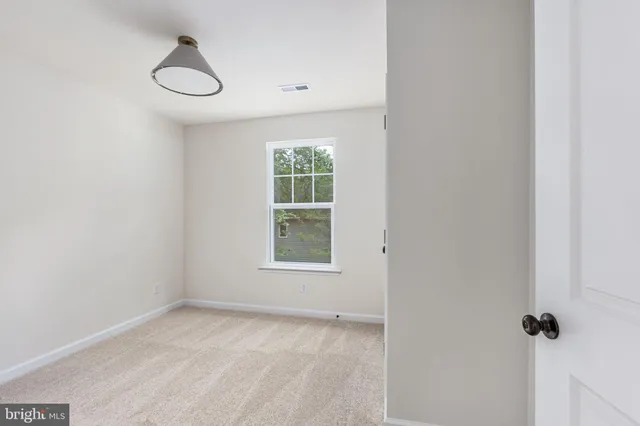 a living room with stainless steel appliances kitchen island granite countertop furniture and a kitchen view