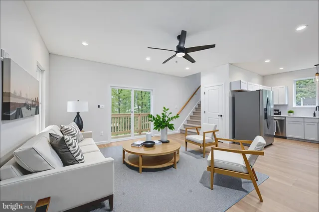 a view of house with a yard and large tree