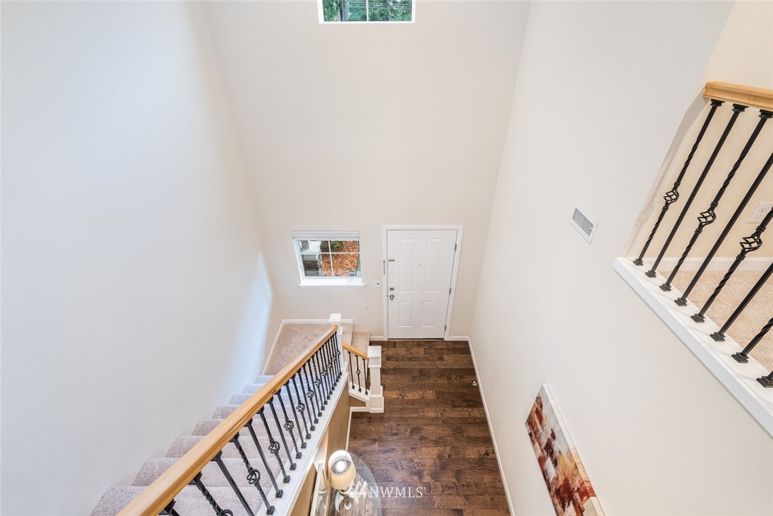 17809 46th Drive Southeast Bothell, WA 98012 - Photo 16 of 35 a view of a hallway with wooden floor and stairs