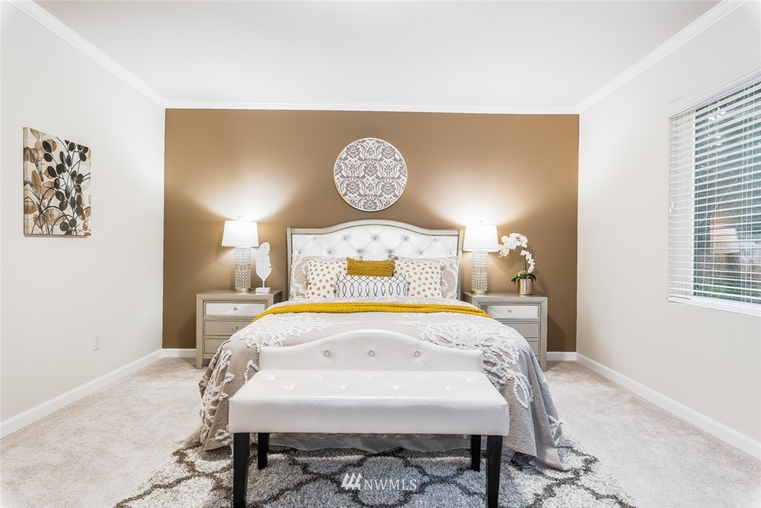 17809 46th Drive Southeast Bothell, WA 98012 - Photo 17 of 35 a bedroom with a bed and a lamp on table
