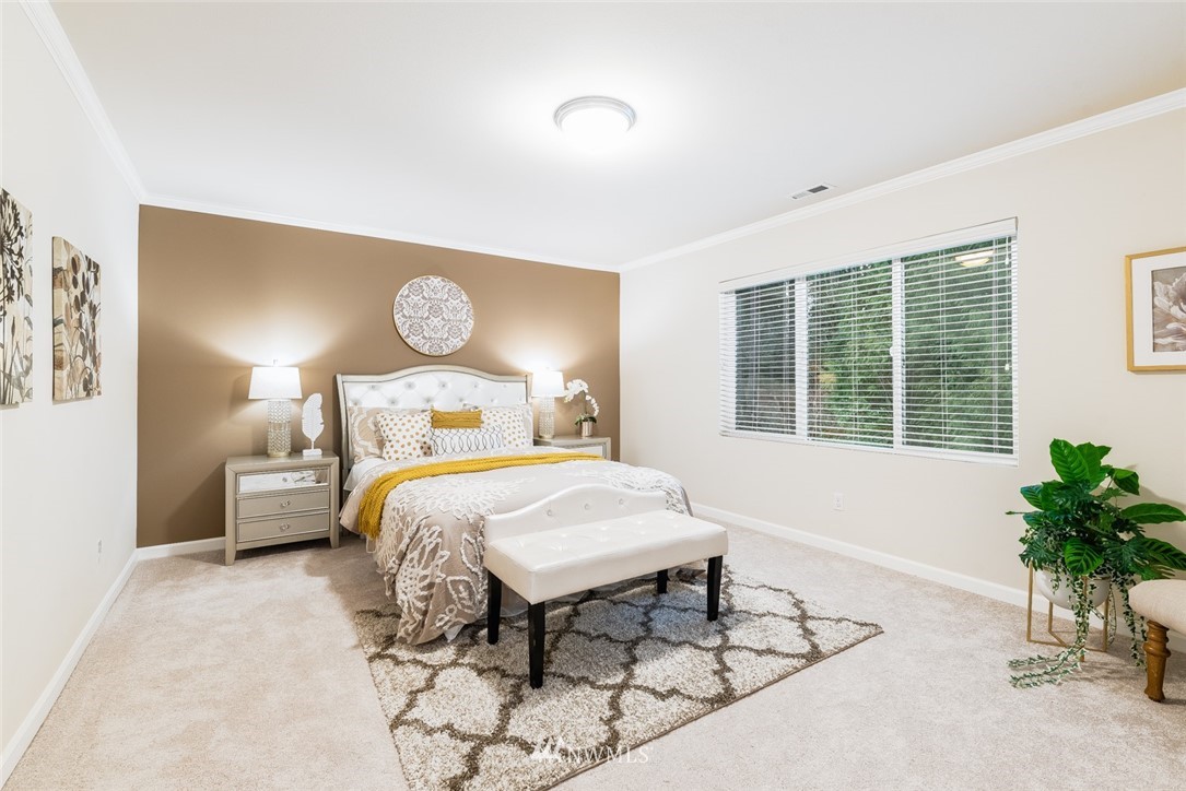 17809 46th Drive Southeast Bothell, WA 98012 - Photo 18 of 35 a bedroom with a bed and potted plant