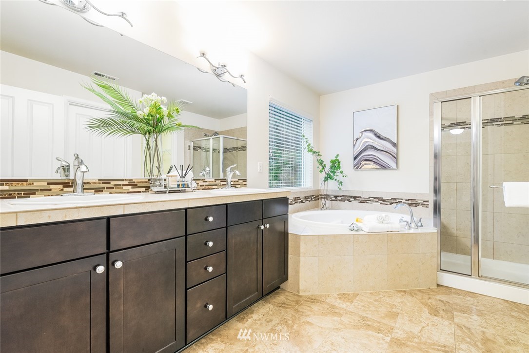 17809 46th Drive Southeast Bothell, WA 98012 - Photo 20 of 35 a bathroom with a tub sink and mirror